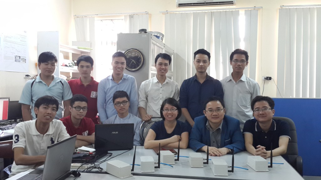 A picture showing members of the project team around a table in an office.